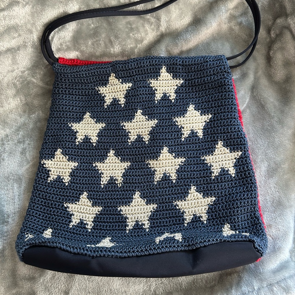 Women’s navy, white, & red star patterned 
patriotic crocheted bag.